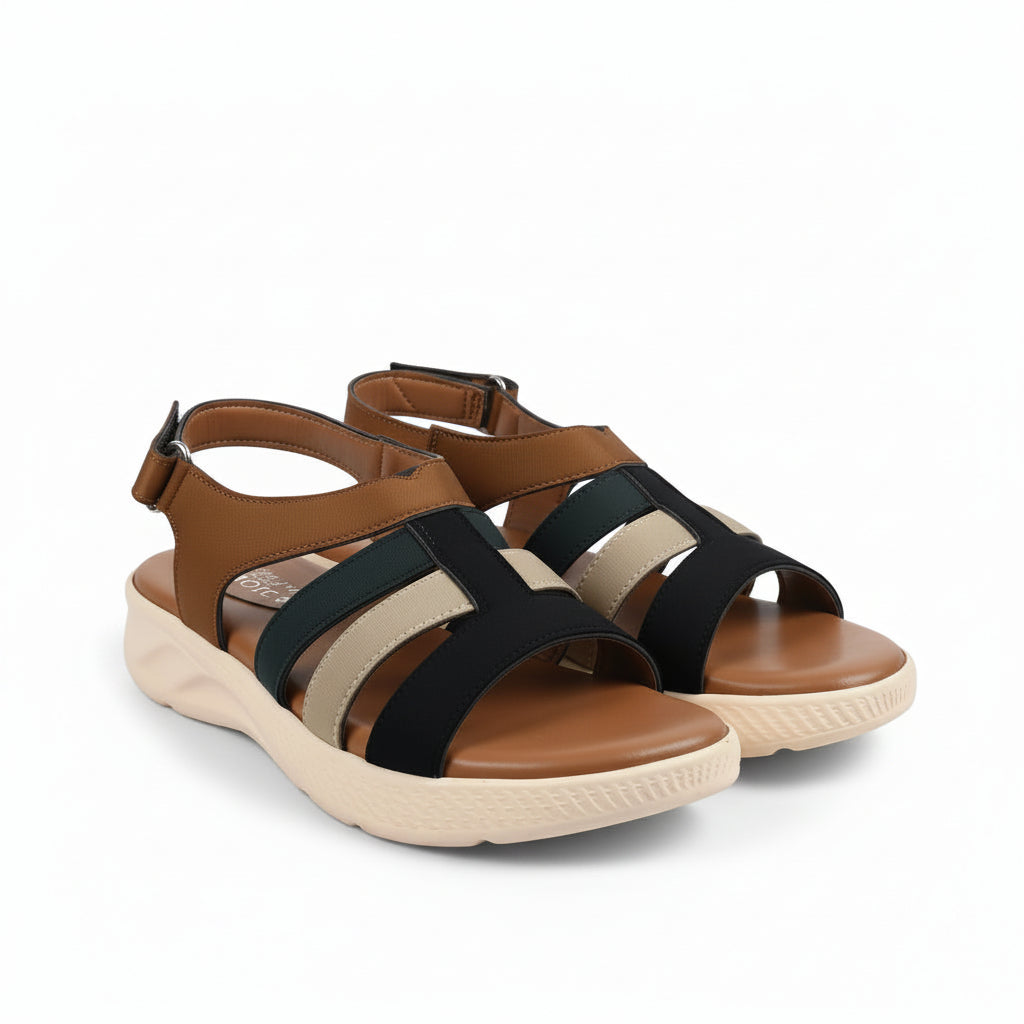 A pair of women's platform sandals in brown, beige, and dark brown, featuring a chunky cream-colored sole and adjustable ankle straps.
