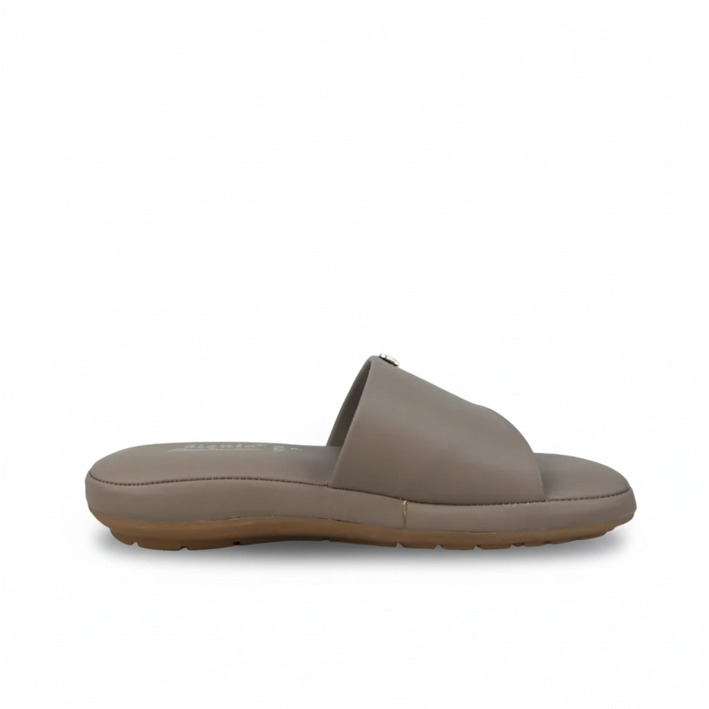 A single taupe leather slide sandal shown in profile against a white fabric backdrop.