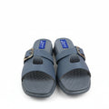 A pair of gray slide sandals with double straps and gold-tone buckles, shown next to an orange and navy shoebox on a white background.