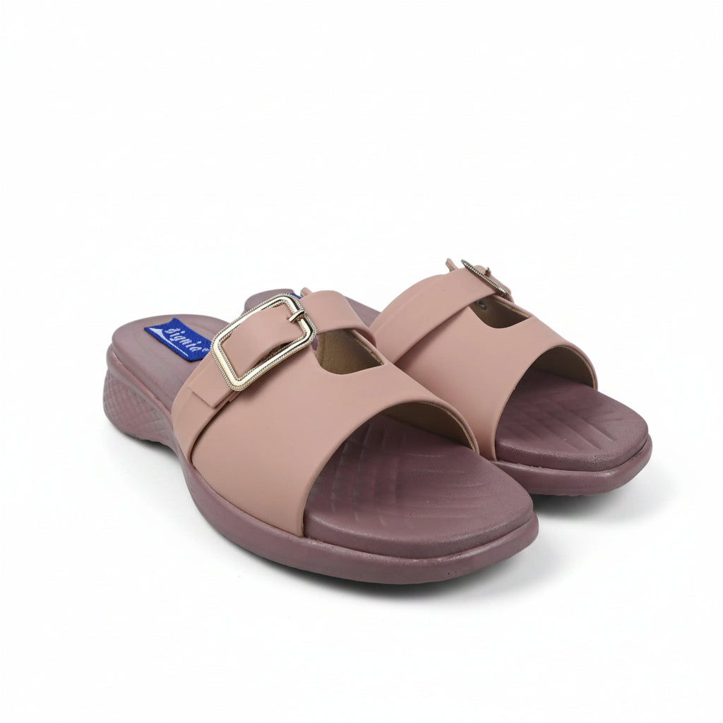 A pair of women's slide sandals in a dusty rose pink color, featuring double straps with gold-tone buckles and a low wedge heel, shown on a white studio background.