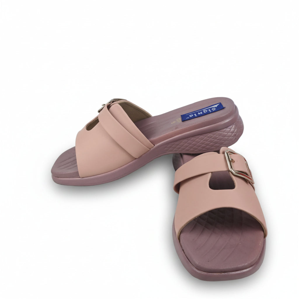 A pair of women's slide sandals in a dusty pink color with mauve-brown soles, displayed on a white background next to a red shoebox.