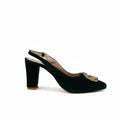 A single dark green velvet slingback high-heeled shoe with a pointed toe and a gold jeweled embellishment on the side, set against a plain white studio background.
