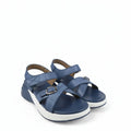 A pair of women's platform sandals in blue, featuring textured straps with silver buckle details and thick white platform soles, photographed on a light gray fabric background.