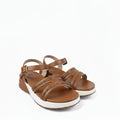 A pair of women's brown leather strappy sandals with rhinestone-embellished straps and white soles, photographed on a white fabric backdrop.
