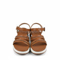 A pair of women's brown strappy sandals with rhinestone-embellished straps and white soles, shown next to a white shoebox on a white background.