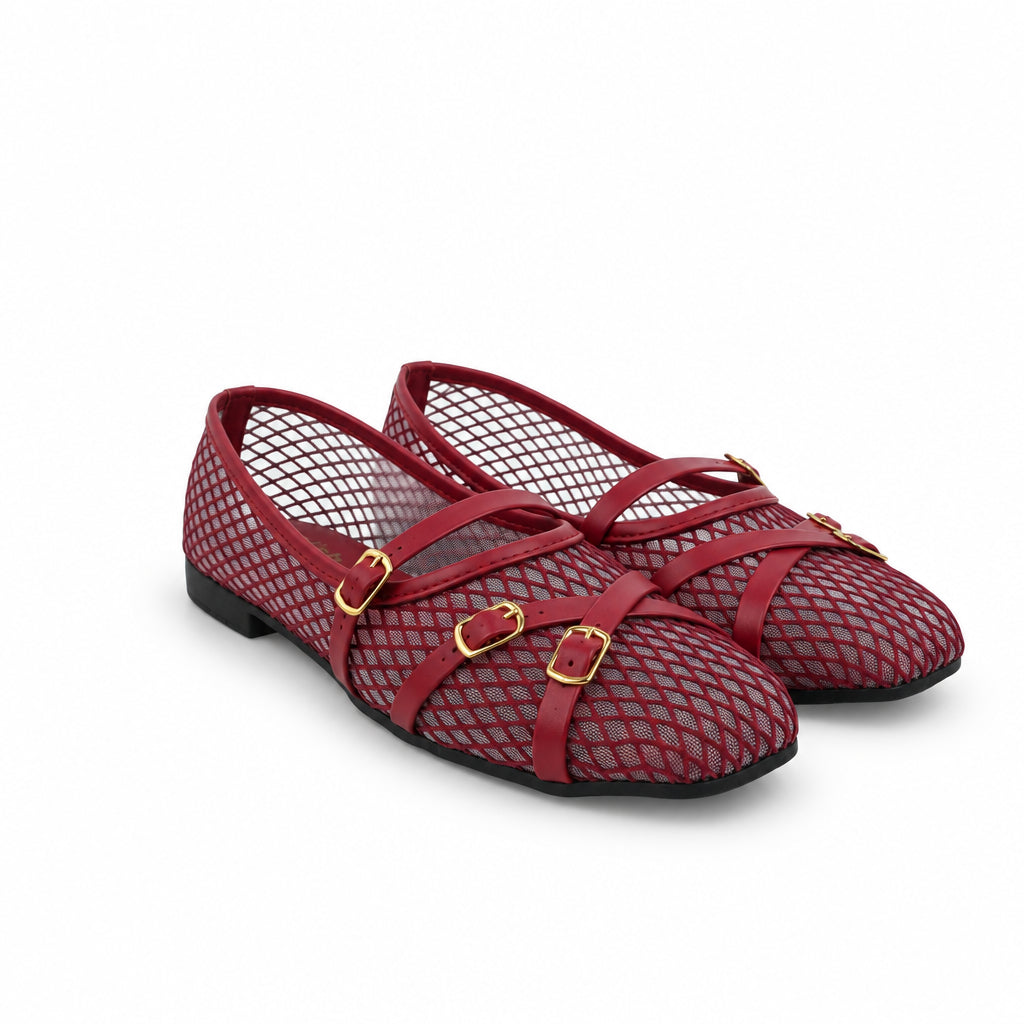 A pair of red fishnet flat shoes with red straps and gold buckle details, shown on a plain white background.