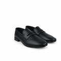 A pair of black leather penny loafers with matching black laces, displayed on a light gray fabric backdrop.