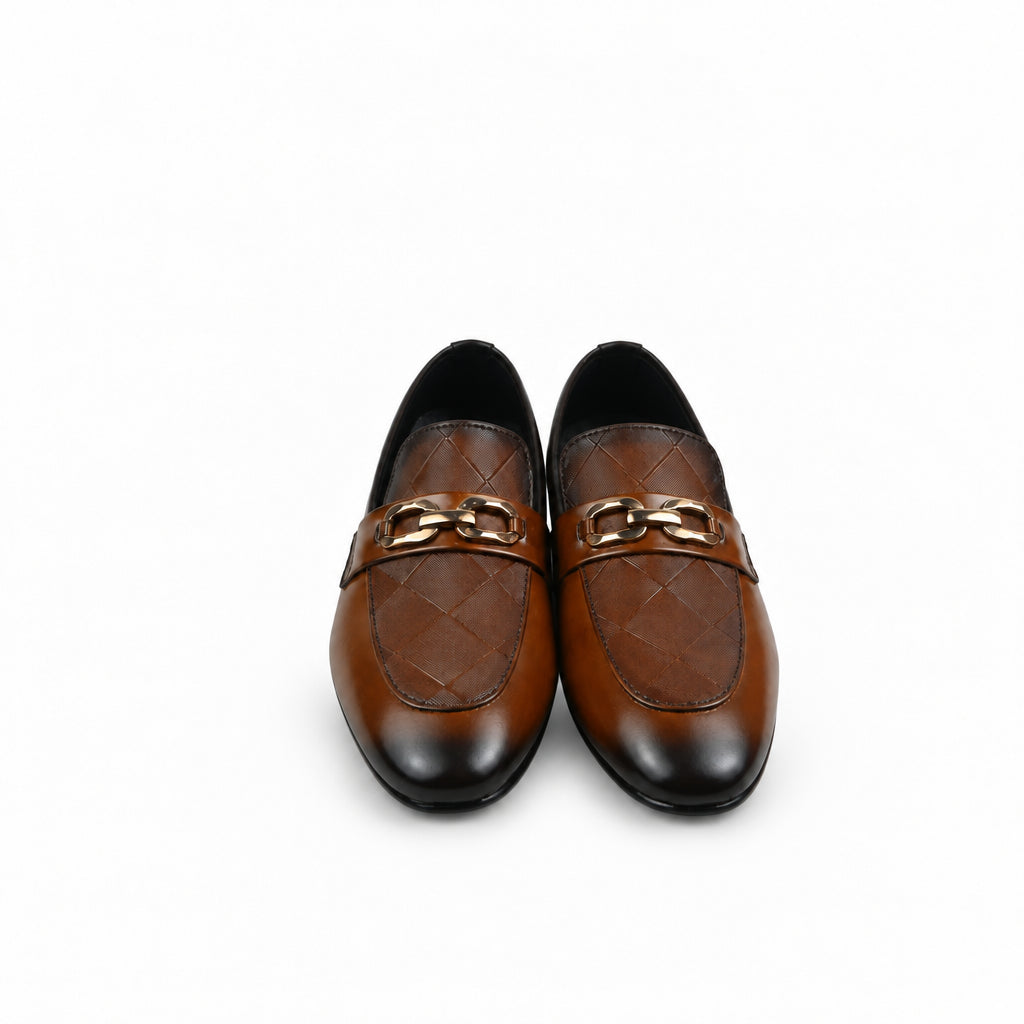 A pair of men's brown leather loafers with a quilted pattern and a gold-tone horsebit detail across the vamp, displayed on a white surface next to an orange shoebox.