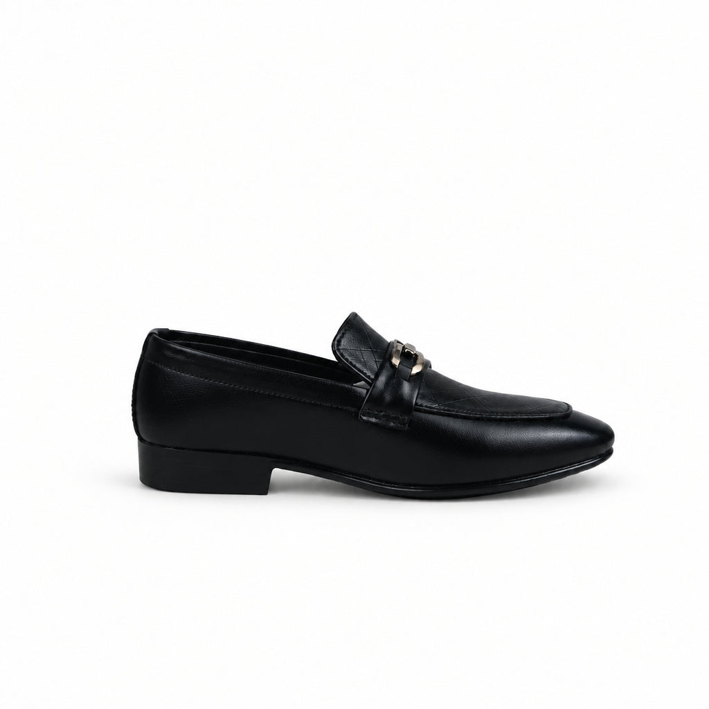 A single black leather loafer with a pointed toe and a small gold-tone horsebit detail on the strap, shown in profile against a white studio backdrop.