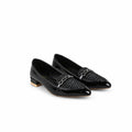 A pair of black leather loafers with woven detailing and a silver-tone chain strap, displayed on a white fabric backdrop.