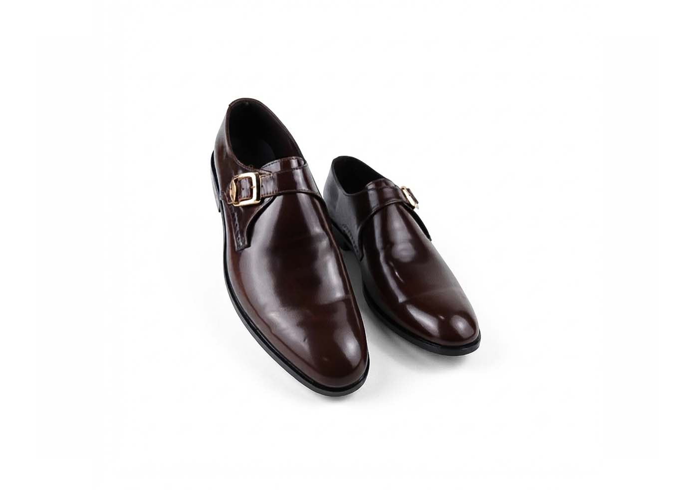 A pair of dark brown  men's dress shoes with a single strap and gold buckle detail, displayed on a clean white background.