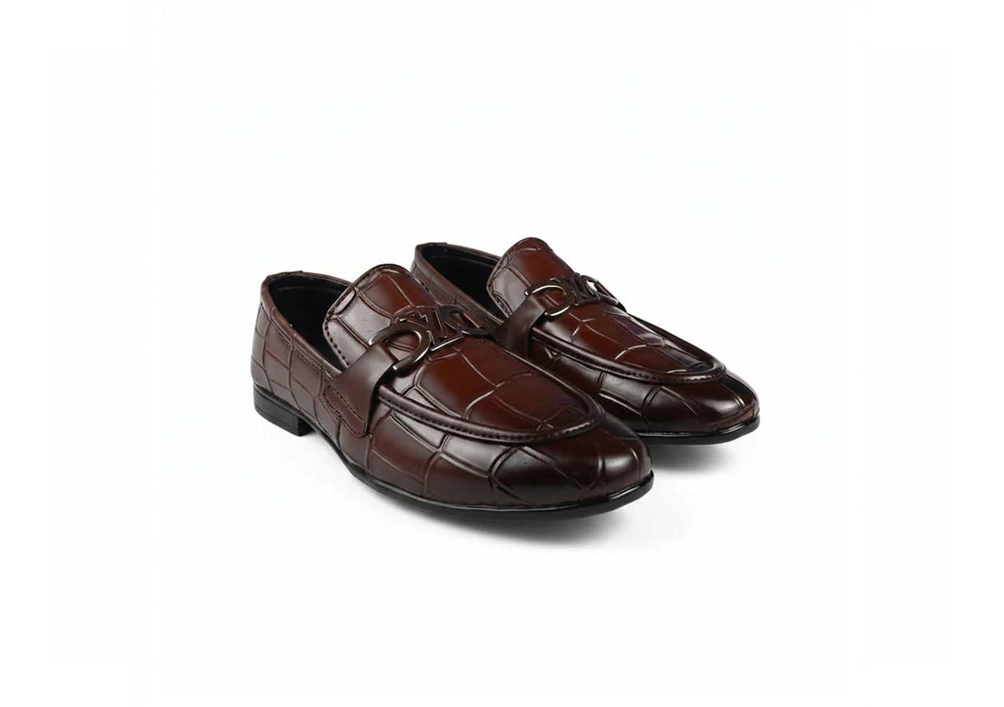 A pair of dark brown  loafers with a crocodile-embossed pattern on the toe and side, displayed on a clean white background.