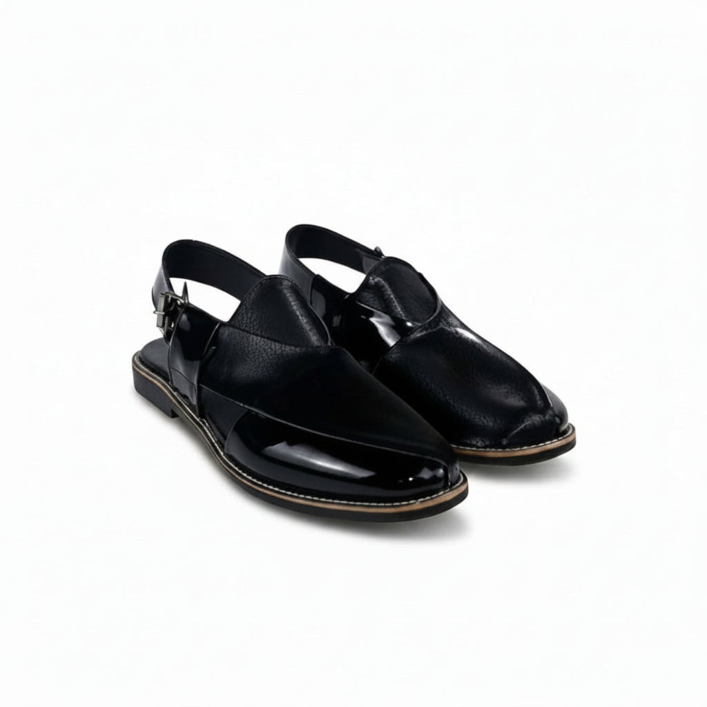 A pair of black leather pointed-toe slingback mule sandals with a glossy patent finish, shown on a clean white background.