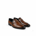 A pair of men's brown leather loafers with a mix of smooth and embossed textures, featuring a decorative strap detail on the vamp, set against a plain white background.