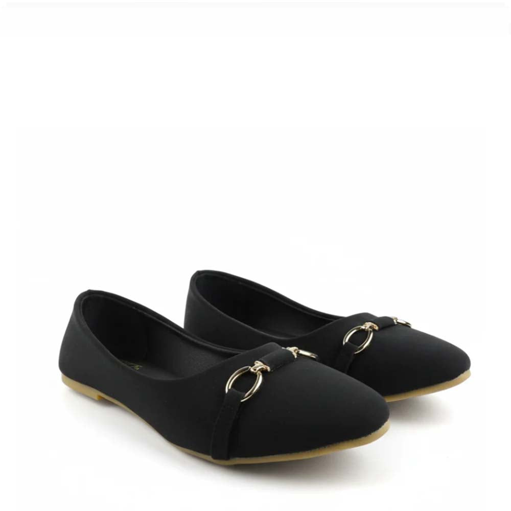 A pair of black flat shoes with a gold-tone horsebit detail on the toe strap, shown against a plain white background.