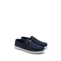 A pair of navy blue slip-on loafers with white soles and gold-tone hardware on a plain white background.