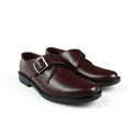 A pair of men's dark burgundy leather double monk strap shoes with silver buckle details, shown on a plain white background.