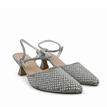 A pair of pointed-toe slingback heels covered in sparkling silver rhinestones, featuring a low block heel and thin wrap-around ankle straps, shown on a plain white background.